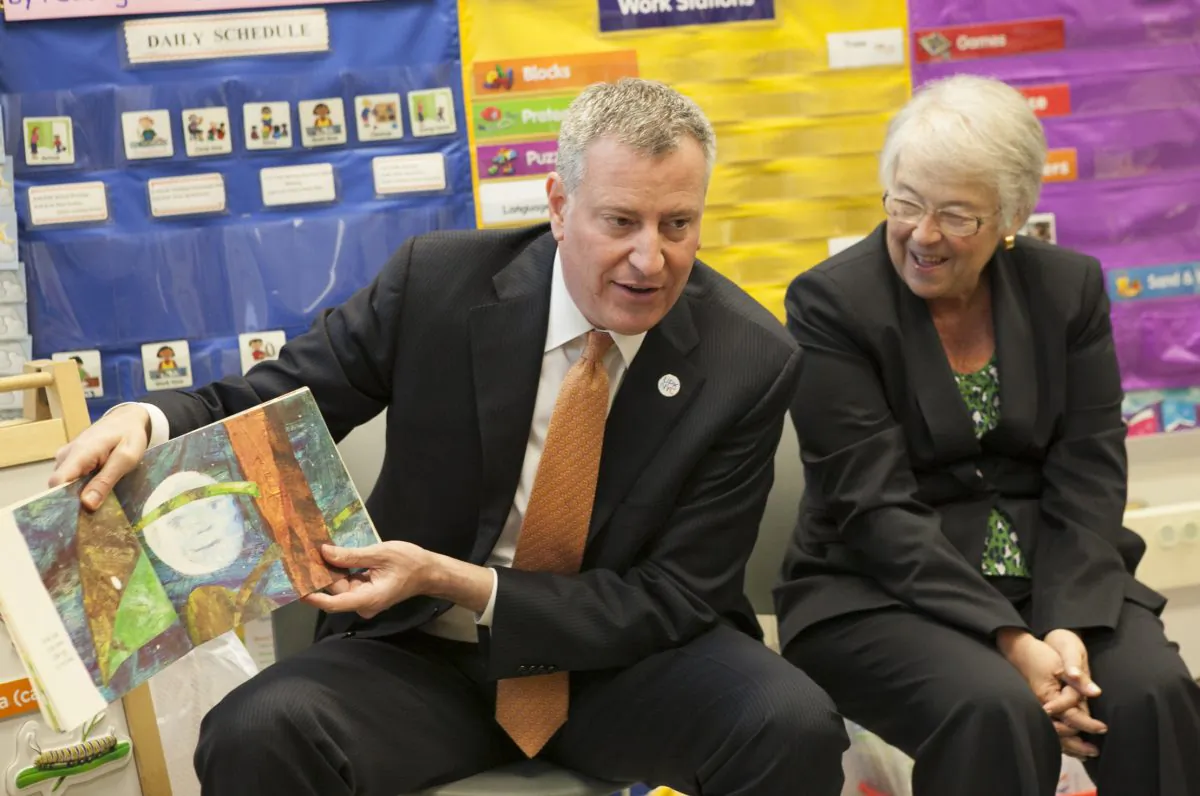 New York City Mayor Bill de Blasio (L) and Schools Chancellor Carmen Farina visit a pre-kindergarten classroom at Police Officer Ramon Suarez School in the Queens borough of New York, on Wednesday, April 2, 2014. New York City children are crammed into classrooms in record numbers, 73 professors of education, psychology, and child development stated in a Monday open letter to Mayor Bill de Blasio and Schools Chancellor Carmen Fariña. (AP Photo/The Wall Street Journal, Andrew Hinderaker, Pool)