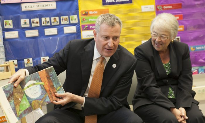 New York City Mayor Bill de Blasio (L) and Schools Chancellor Carmen Farina visit a pre-kindergarten classroom at Police Officer Ramon Suarez School in the Queens borough of New York, on Wednesday, April 2, 2014. New York City children are crammed into classrooms in record numbers, 73 professors of education, psychology, and child development stated in a Monday open letter to Mayor Bill de Blasio and Schools Chancellor Carmen Fariña. (AP Photo/The Wall Street Journal, Andrew Hinderaker, Pool)
