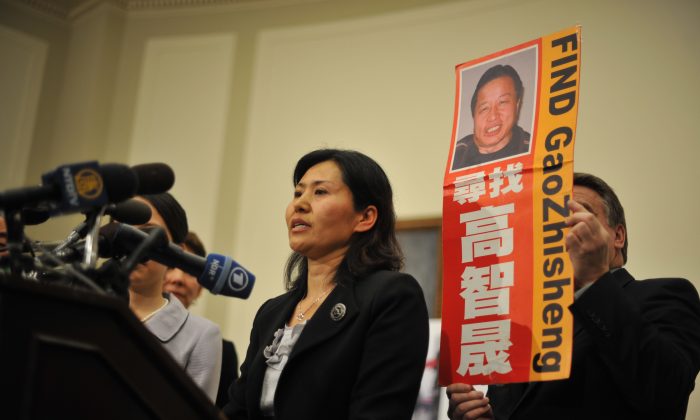 Geng He, the wife of Chinese rights lawyer Gao Zhisheng, participates in a press conference on Jan. 18, 2011, in Washington, DC. The American Board of Trial Advocates wrote a letter to U.S. President Obama on Monday, calling on him to help bring the Chinese rights lawyer Gao Zhisheng to the United States for medical treatment and uniting with his family. (Tim Sloan/AFP/Getty Images)