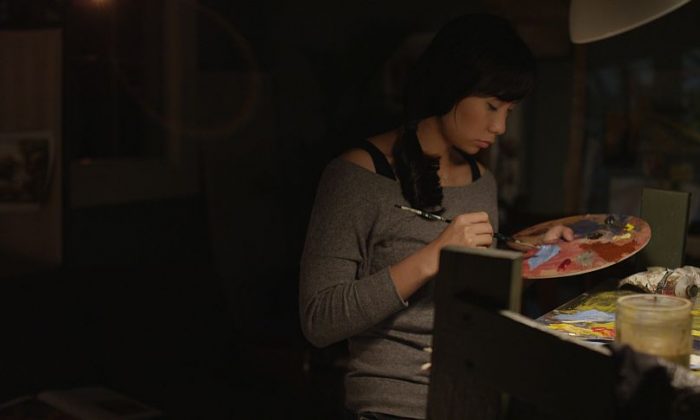 Livi Zheng plays an art forger in her self-directed “Brush With Danger.” (Sun and Moon Films)