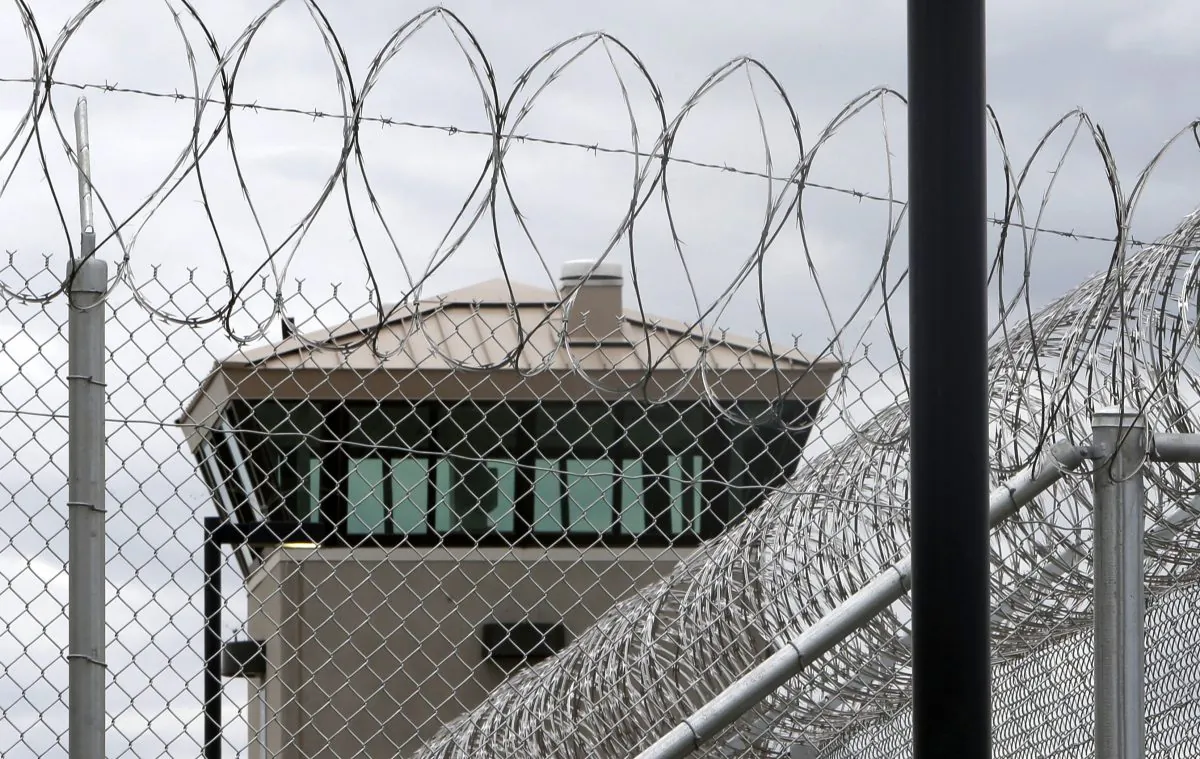 A guard tower over the fence surrounding the new California Correctional Health Care Facility in Stockton, Calif., on June 25, 2013. (AP Photo/Rich Pedroncelli)