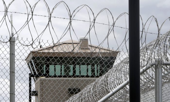 A guard tower over the fence surrounding the new California Correctional Health Care Facility in Stockton, Calif., on June 25, 2013. (AP Photo/Rich Pedroncelli)