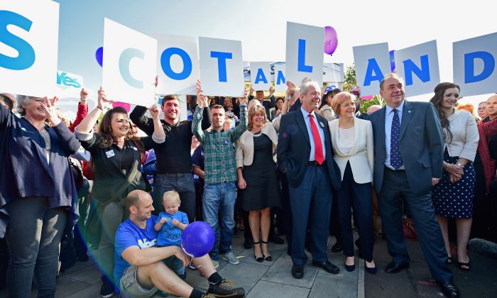 Scottish First Minister Alex Salmond, Deputy First Minister Nicola Sturgeon, and Jim Sillars, former deputy leader of the SNP campaign, with "Yes" activists in Edinburgh, Scotland, on Sept. 10, 2014. (Photo by Jeff J Mitchell/Getty Images)