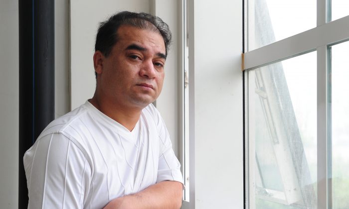 University professor, blogger, and member of the Muslim Uighur minority, Ilham Tohti pauses before a classroom lecture in Beijing on June 12, 2010. State-run Xinhua news agency has complained that Western news media were referring to Tohti, recently given a sentence of life in prison for "separatism," as "China's Mandela." (Frederic J. Brown/AFP/Getty Images)