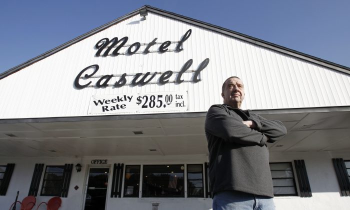 Owner Russ Caswell outside his Motel Caswell in Tewksbury, Mass. on Nov. 9, 2011. Caswell fought to keep the federal government from taking his motel because the government claimed there was drug-dealing among the motel's guests. A Federal judge dismissed the case in January of 2013. (Winslow Townson/AP Photo)