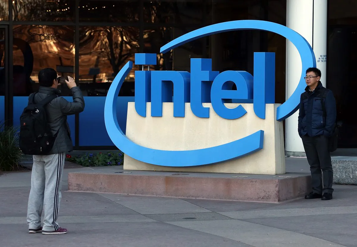 Visitors take pictures next to the Intel logo outside of the Intel headquarters on January 16, 2014 in Santa Clara, California. (Justin Sullivan/Getty Images)