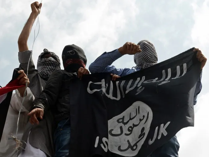 Kashmiri demonstrators hold up a flag of the Islamic State of Iraq and the Levant (ISIL) during a demonstration in India against Israeli military operations in Gaza, in downtown Srinagar, on July 18, 2014. (Tauseef Mustafa/AFP/Getty Images)