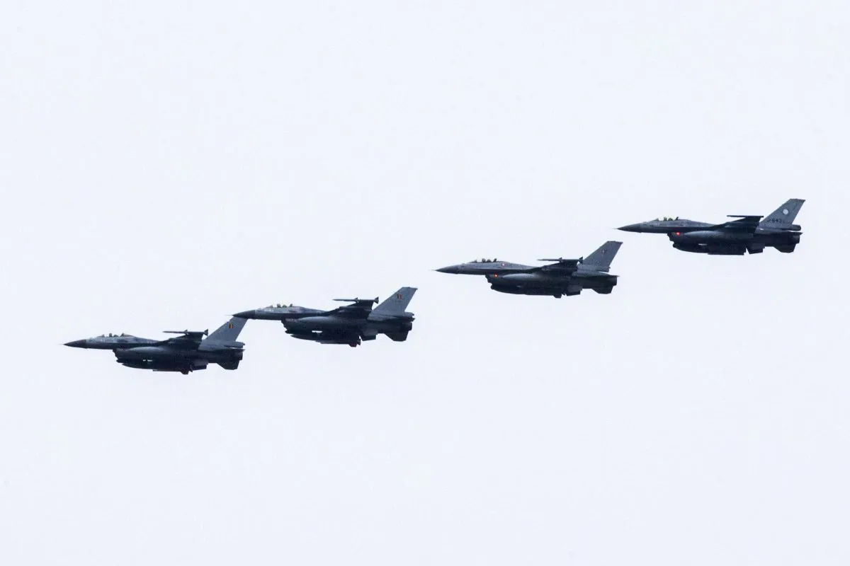 Four Dutch F-16s fly near the Leeuwarden Airbase near Leeuwarden on Sept. 25, 2014. Six Dutch F-16 fighter bombers are to join the US-led air campaign against the Islamic State group in Iraq, Deputy Prime Minister Lodewijk Asscher announced. (Vincent Jannink/AFP/Getty Images)