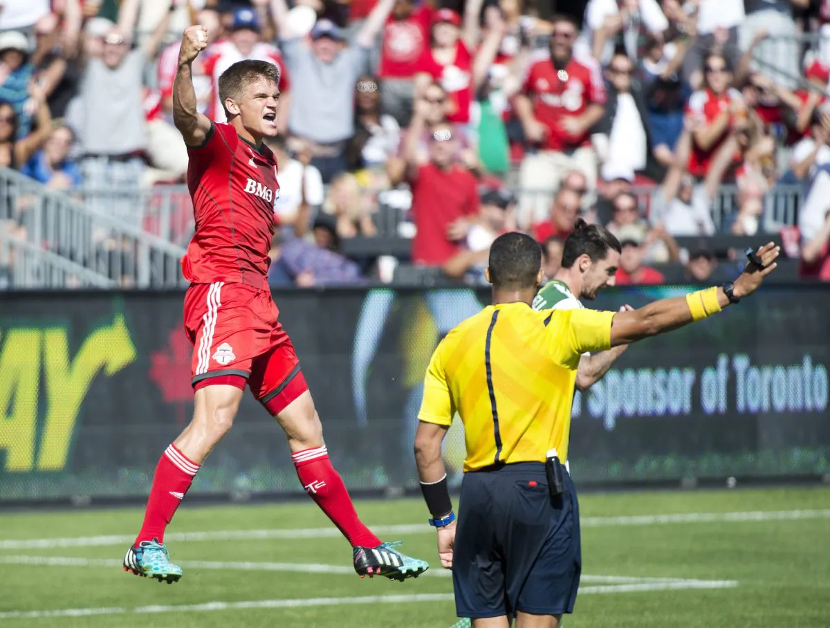 Toronto FC defender Nick Hagglund celebrates after a scoring against the Portland Timbers at BMO Field in Toronto on Sept. 27, 2014. (The Canadian Press/Nathan Denette)