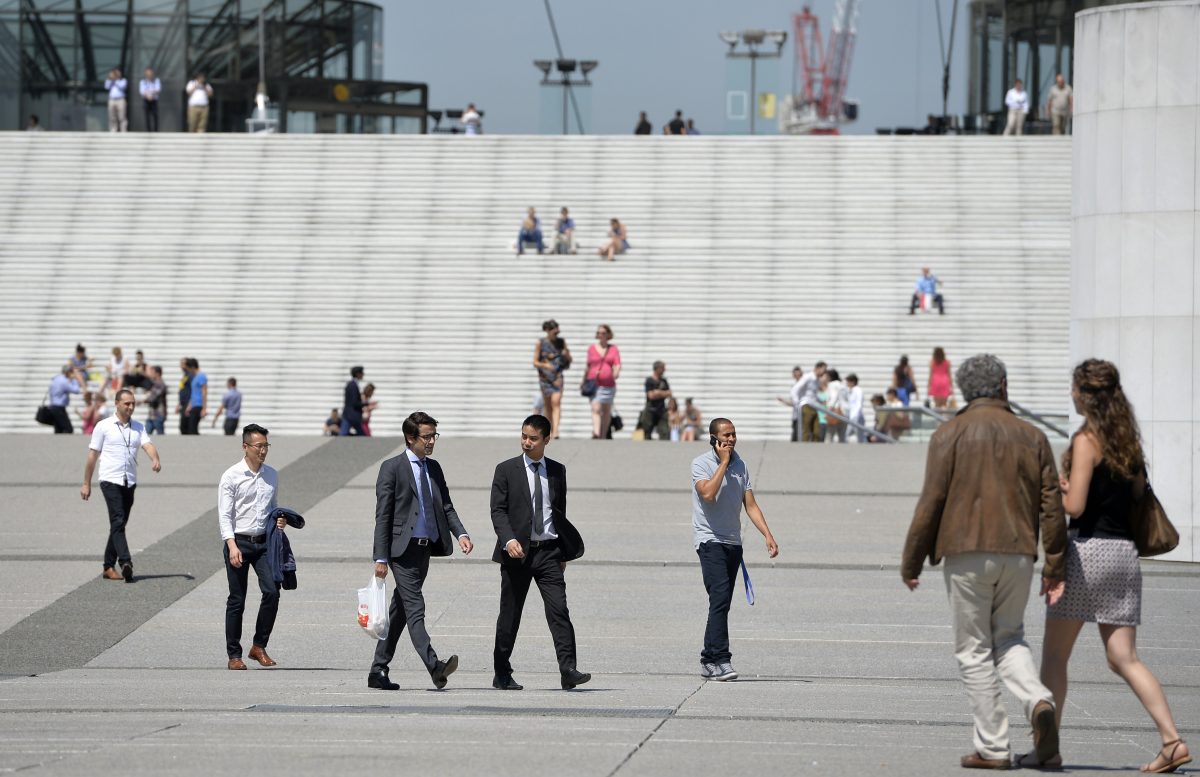 People walk at La Defense business district, outsisde Paris, on July 17, 2014. 48% of the French people say they are pessimistic about their own future, even though their country has a good index of global development. (Miguel Medina/AFP/Getty Images)