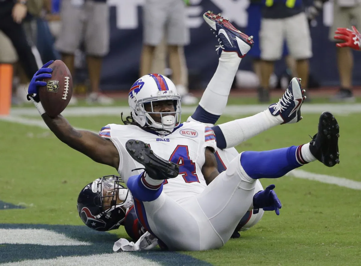 Buffalo Bills' Sammy Watkins (14) scores as Houston Texans' Darryl Morris (26) defends during the second quarter of an NFL football game, Sunday, Sept. 28, 2014, in Houston. (AP Photo/David J. Phillip)