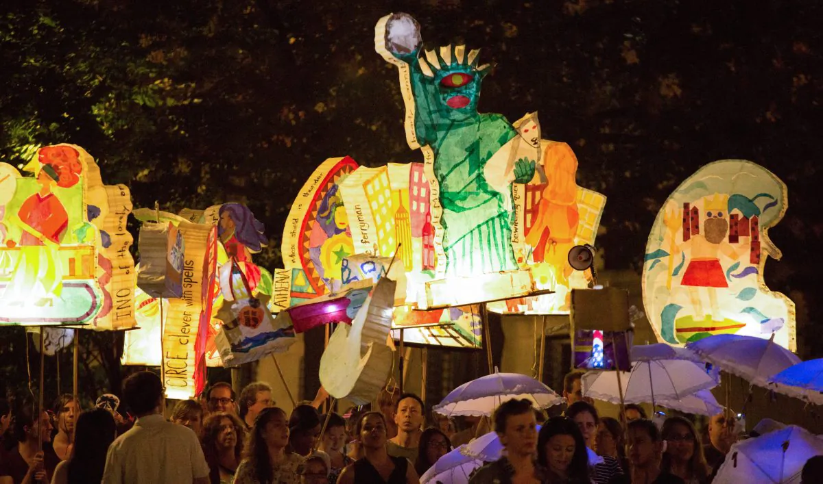 Hundreds carry illuminated lanterns created by community members of Morningside Heights and Harlem, relating Homer's “The Odyssey” to their own neighborhood and experiences, through Morningside Park, Manhattan, N.Y., on Sept. 27, 2014. (Laura Cooksey)