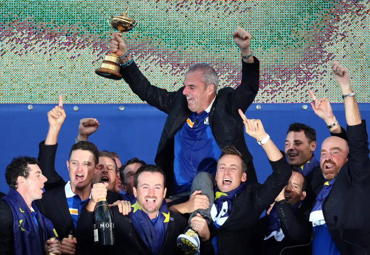 Europe players lift their captain Paul McGinley as he holds the trophy after winning  the 2014 Ryder Cup golf tournament, at Gleneagles, Scotland, Sunday, Sept. 28, 2014. (AP Photo/Scott Heppell)