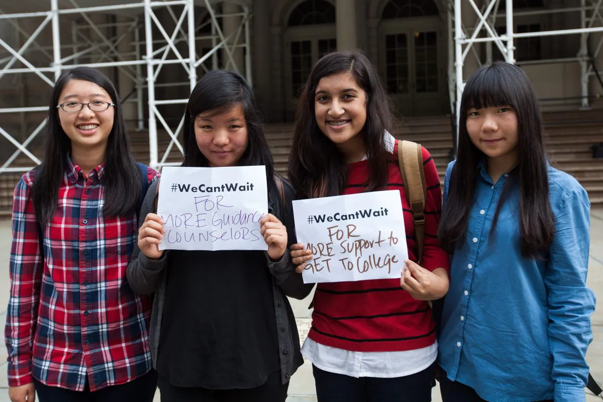 Dannie Li, Ying Dong, Aronno Shafi, and Boey Zhang after appealing for more guidance counselors, in Manhattan, New York on Monday, Sept. 29, 2014. (Petr Svab/Epoch Times)