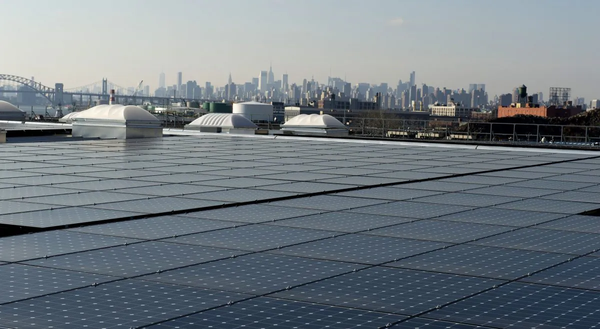 Solar panels on the rooftop in the Bronx, with a view of Manhattan in the distance, on January 17, 2014 in New York. (Don Emmert/AFP/Getty Images)