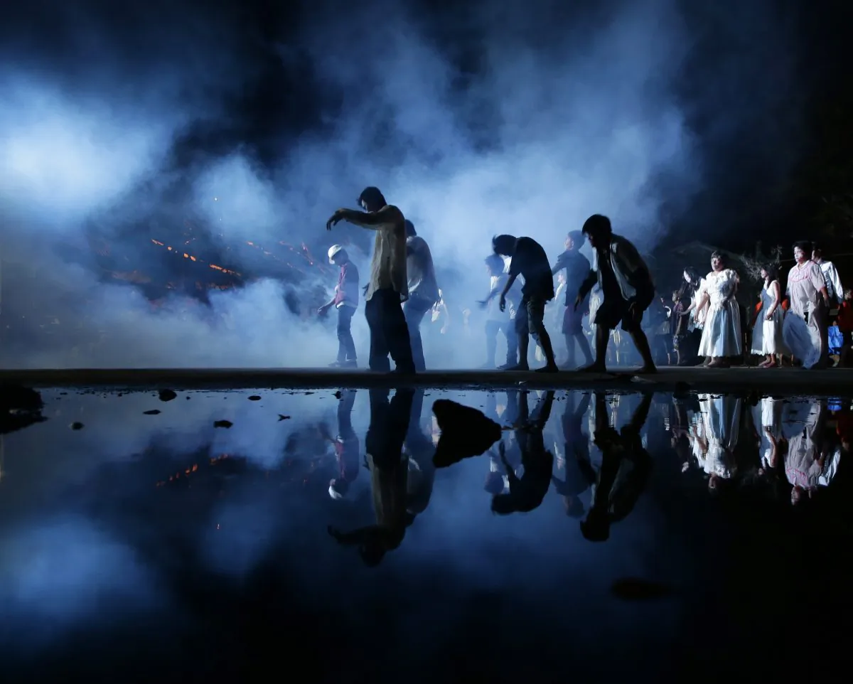 Filipino dancers perform to Michael Jackson's hit song "Thriller" at dawn on Sunday, Oct. 27, 2013, at a park in Obando township, Bulacan province north of Manila, Philippines. The performance was part of simultaneous worldwide dance events to celebrate the album's 30th anniversary and an attempt for a Guinness World Record. (AP Photo/Bullit Marquez)