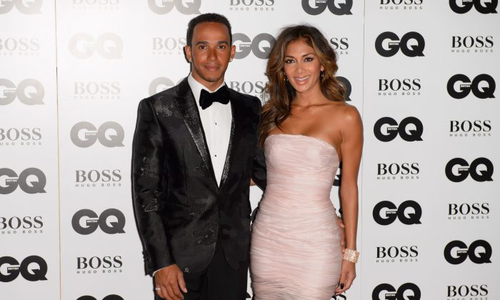 Lewis Hamilton and Nicole Scherzinger arrive for the GQ Men Of The Year Awards 2014 at a central London venue, London, Tuesday, Sept. 2, 2014. (Photo by Jonathan Short/Invision/AP)
