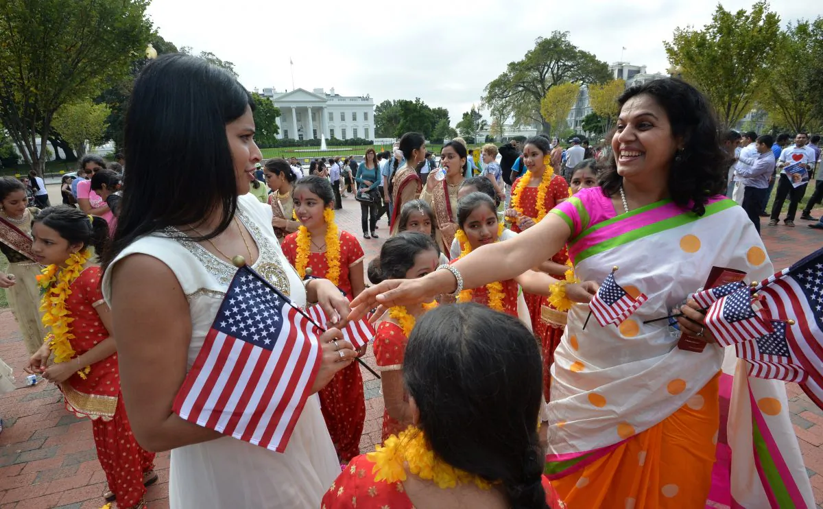 Indian people living in the US gather in support outside the White House, where Indian Prime Minister Narendra Modi met with US President Barack Obama in Washington, DC, on September 30, 2014. Modi launched his Washington visit late on Monday at a private dinner hosted by Obama and Vice President Joe Biden in the ornate Blue Room of the White House. He came to Washington after wowing members of the Indian diaspora in New York and making his debut at the United Nations General Assembly, following his Bharatiya Janata Party's (BJP) landslide election win in May. (Mladen Antonov/AFP/Getty Images)
