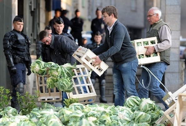 24 September, 2014: Protesting cultivators bring cauliflowers in front of the Prefecture of Saint-Brieux, Brittany, France (Fred Tanneau/AFP/Getty Images)