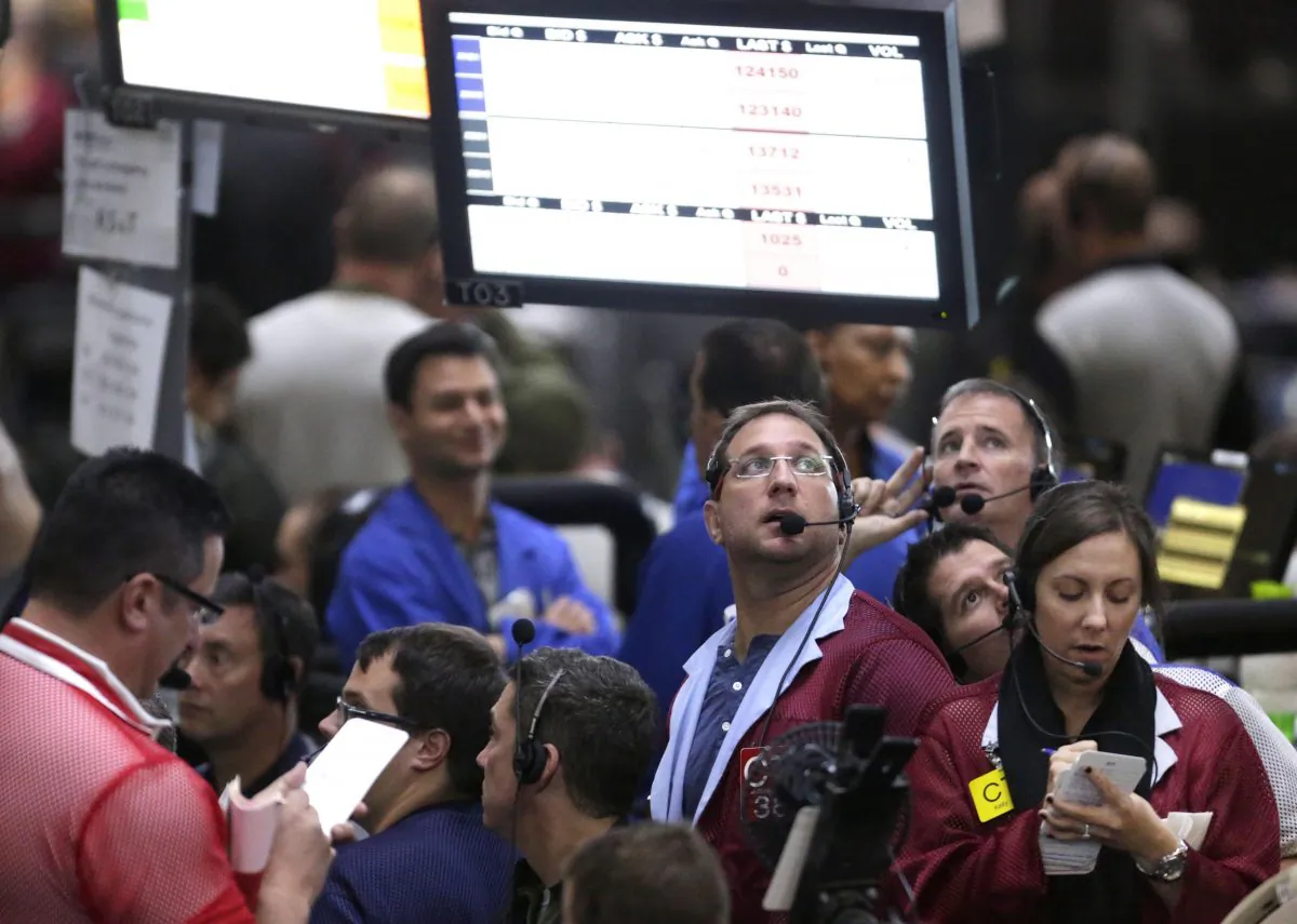 Traders work in the 10-year bond pit on the floor of the CME Group in Chicago, Ill., on Sept. 24, 2014. (AP Photo/M. Spencer Green)