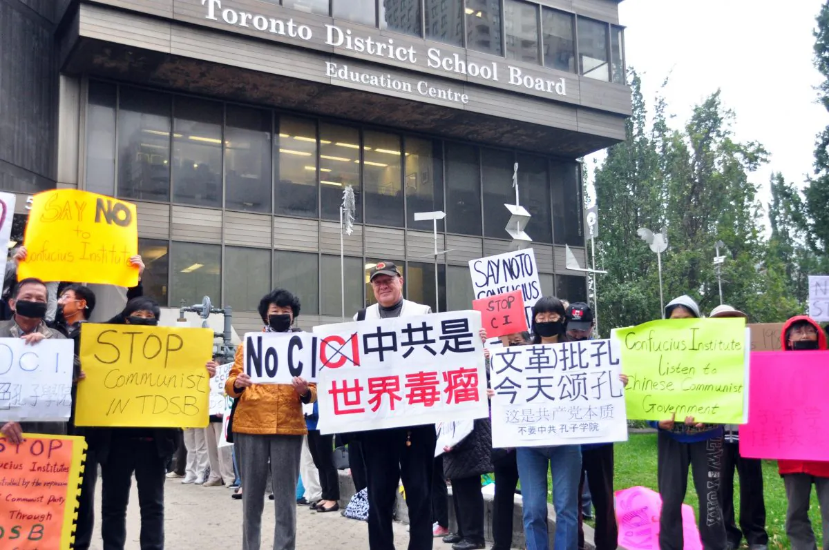 People demonstrate against the Toronto School Board's partnership with the Beijing-controlled Confucius Institute outside the TDSB on Oct. 1, 2014. A committee has voted in favour terminating the TDSB's Confucius Institute program. The issue will now go before the entire board for a vote at the end of the month. (Allen Zhou/Epoch Times)