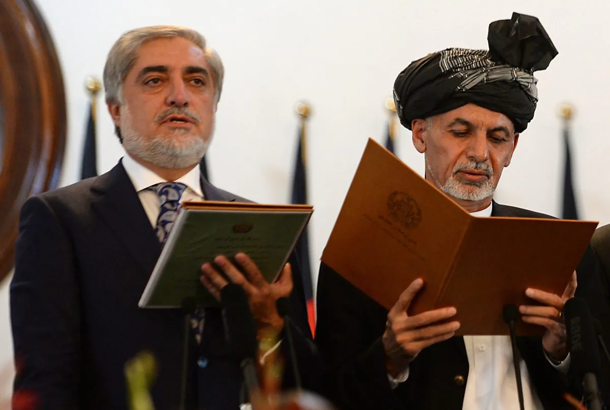 Newly-sworn in Afghan President Ashraf Ghani (R) administers the oath to Abdullah Abdullah (L) as Afghanistan's new Chief Executive during the swearing in ceremony for the country's new president at the Presidential Palace in Kabul on Sept. 29, 2014. Ashraf Ghani, a one-time US-based academic, was sworn in as the new president of Afghanistan on Sept. 29, taking power as NATO troops end their 13-year war without defeating the fierce Taliban insurgency. Abdullah was also sworn in as chief executive, a new role similar to a prime minister, in a government structure far different to Karzai's all-powerful presidency. (Shah Marai/AFP/Getty Images)