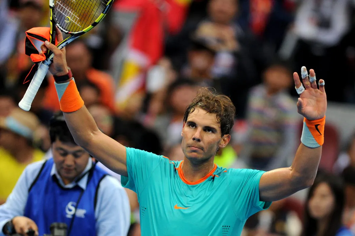 Rafael Nadal of Spain waves after winning against Peter Gojowczyk of Germany during men's singles second round match at the China Open tennis tournament in the National Tennis Center of Beijing on October 2, 2014. (WANG ZHAO/AFP/Getty Images)