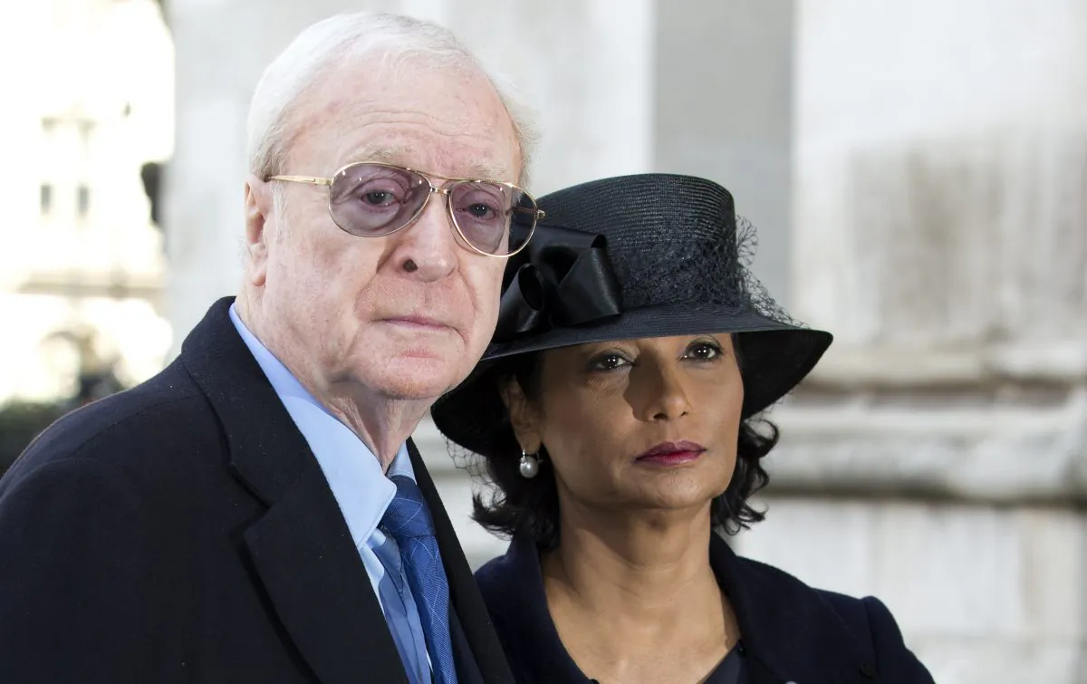 British actor Michael Caine and his wife Shakira arrive for the Sir David Frost memorial service at Westminster Abbey in London,Thursday, March, 13, 2014.  British broadcaster David Frost died in August 2013, one of his most famous interviews was with President Richard Nixon. (AP Photo/Alastair Grant)