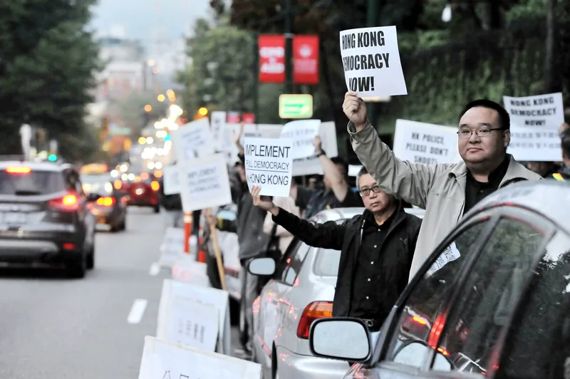 People demonstrate in Vancouver, Canada, to express solidarity for the pro-democracy movement in Hong Kong. (Jing Hao/Epoch Times)