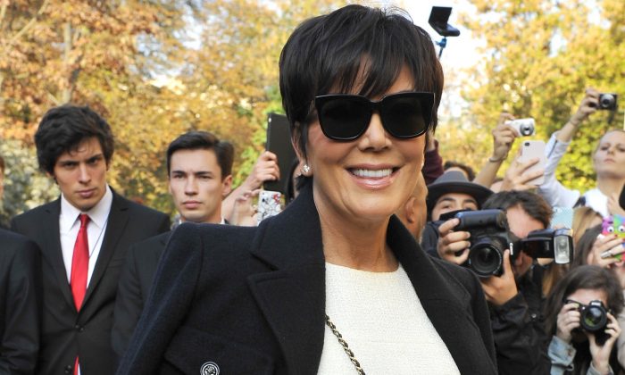 Kris Jenner arrives at Chanel's Spring/Summer 2015 ready-to-wear fashion collection presented in Paris, France, Tuesday, Sept. 30, 2014. (AP Photo/Zacharie Scheurer)
