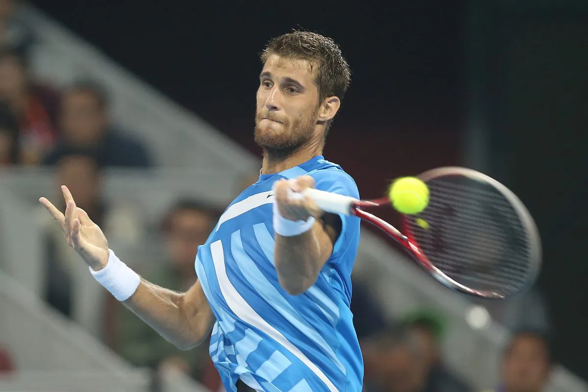 Martin Klizan of Slovakia returns a shot against Rafael Nadal of Spain during day seven of the China Open at the China National Tennis Center on October 3, 2014 in Beijing, China. (Emmanuel Wong/Getty Images)