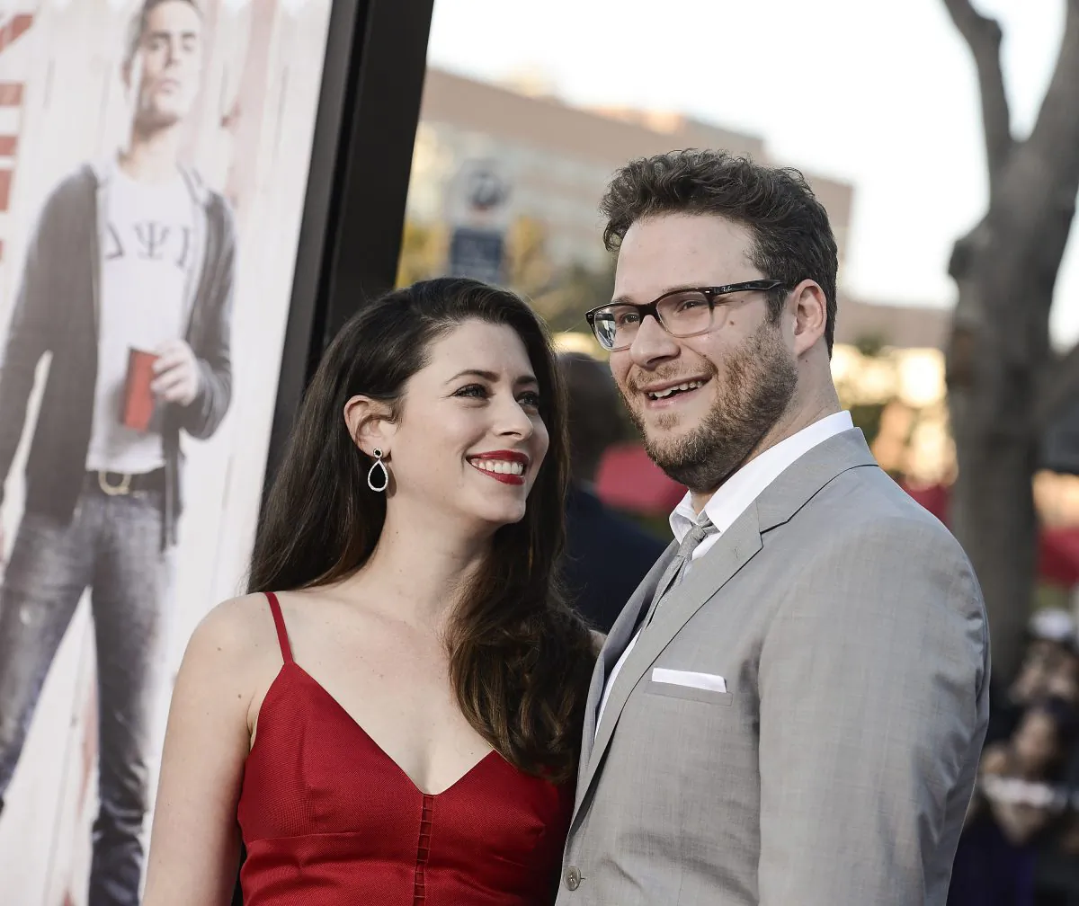 Actor Seth Rogen, right, and his wife Lauren Miller attend the premiere of the feature film "Neighbors" on Monday, April 28, 2014 in Los Angeles. (Photo by Dan Steinberg/Invision/AP Images)