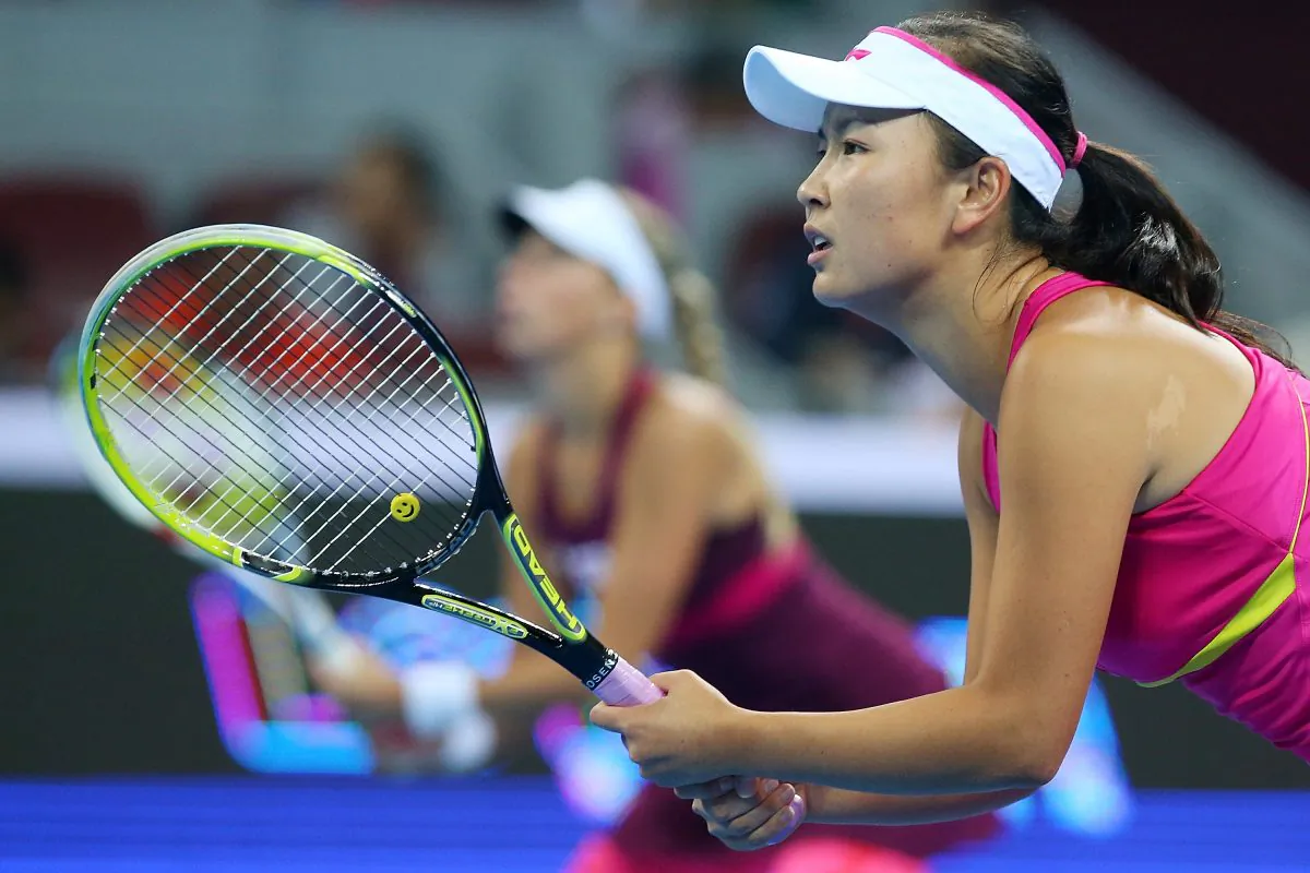 Peng Shuai of China and partner Andrea Hlavackova of the Czech Republic in action during the women's doubles final against Cara Black of Zimbabwe and Sania Mirza of India during day eight of the China Open at the China National Tennis Center on October 4, 2014 in Beijing, China. (Chris Hyde/Getty Images)