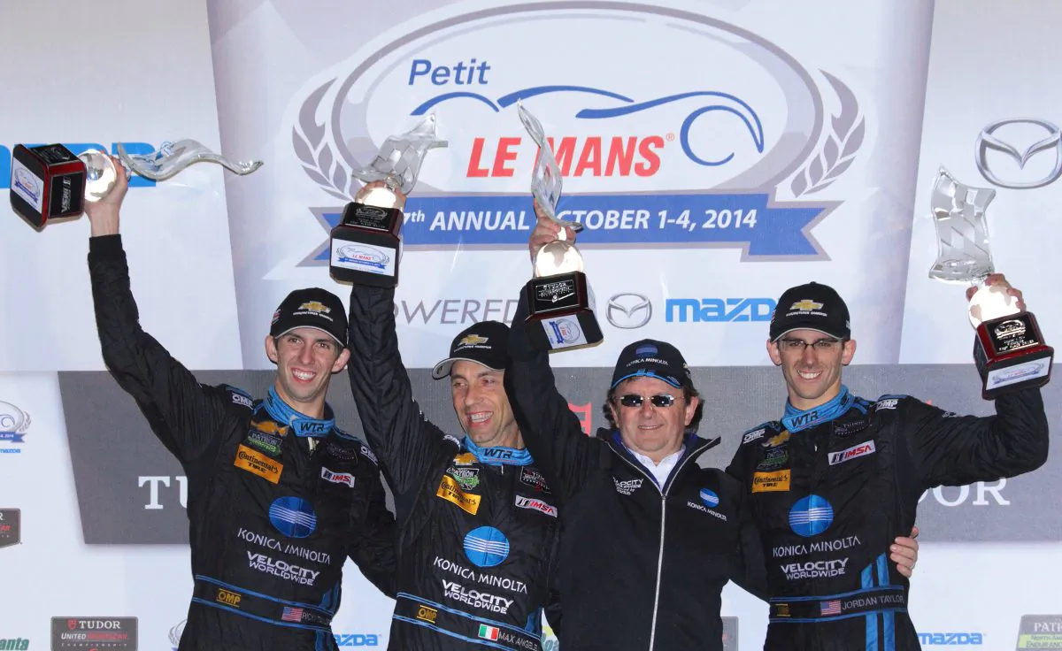 Ricky Taylor, Max Angelelli, Wayne Taylor, and Jordan Taylor, celebrate winning the 2014 Tudor United Sportscar Championship Petit Le Mans. (Chris Jasurek/Epoch Times)