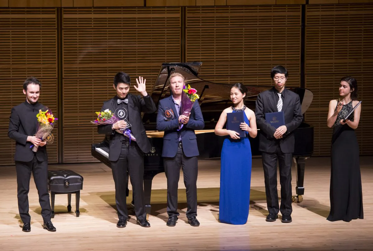 Finalists of the NTD Television's 2014 International Piano Competition at the Future Stars Recital at Carnegie Hall on Oct. 5, 2014. (L–R): Timur Mustakimov (gold), Joseph Choi (silver), Anton Smirnov (bronze), Aileen Gozali (honorable mention), Wesley Chu (outstanding performance), and Tania Rivers-Moore (honorable mention). (Dai Bing/Epoch Times)