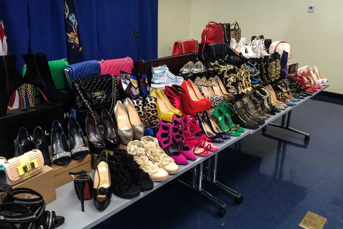 A selection of the stolen designer merchandise found in the Queens apartment of identity theft ringleader Tamara Williams displayed at the Manhattan District Attorney's press conference on Oct. 6, 2014 (Jonathan Zhou/Epoch Times)