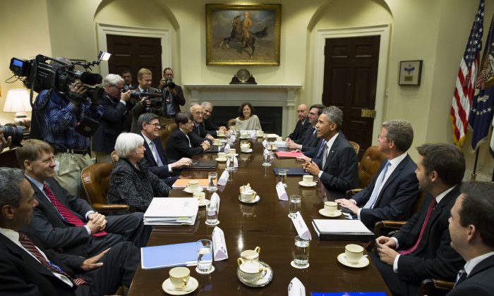 President Barack Obama meets with financial regulators in the Roosevelt Room of the White House in Washington, Monday, Oct. 6, 2014. (L-R) Director of the Federal Housing Finance Agency Mel Watt, Director of the Consumer Financial Protection Bureau Richard Cordray, Federal Reserve Chair Janet Yellen, Treasury SecretaryJacob Lew, Securities and Exchange Commission (SEC) Chair Mary Jo White, Commodity Futures Trading Commission (CFTC) Chairman Tim Massad, Federal Deposit Insurance Corporation (FDIC) Chairman Martin Gruenberg, Deputy Treasury Secretary Sarah Bloom Raskin, White House Council Neil Eggleston, Council of Economic Advisers Chairman Jason Furman, Obama, Budget Director Shaun Donovan, Deputy Budget Director Brian Deese, and Special Assistant to the President for Economic Policy Seth Wheeler. (AP Photo/Evan Vucci)