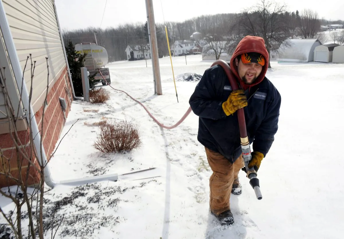 Heating oil, more widely used in Atlantic Canada for home heating than other parts of the country, is delivered to a home in this file photo. (John Rucosky/AP Photo via Tribune-Democrat)
