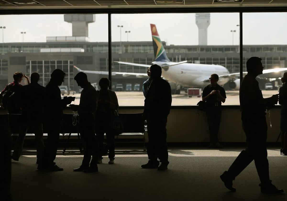 People stand in the main terminal at Washington Dulles International Airport in Dulles, Va., on Oct. 2, 2014. (Mark Wilson/Getty Images)
