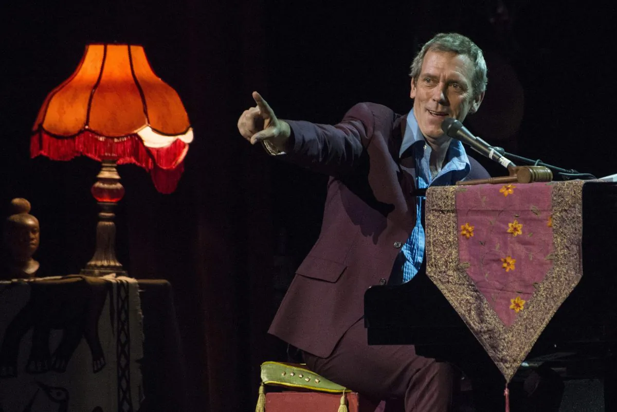British performer Hugh Laurie gestures as he performs with The Copper Bottom Band, during their concert at the Budapest Congress Centre, in Budapest, Hungary, Saturday, July 19, 2014. (AP Photo/MTI, Bea Kallos)