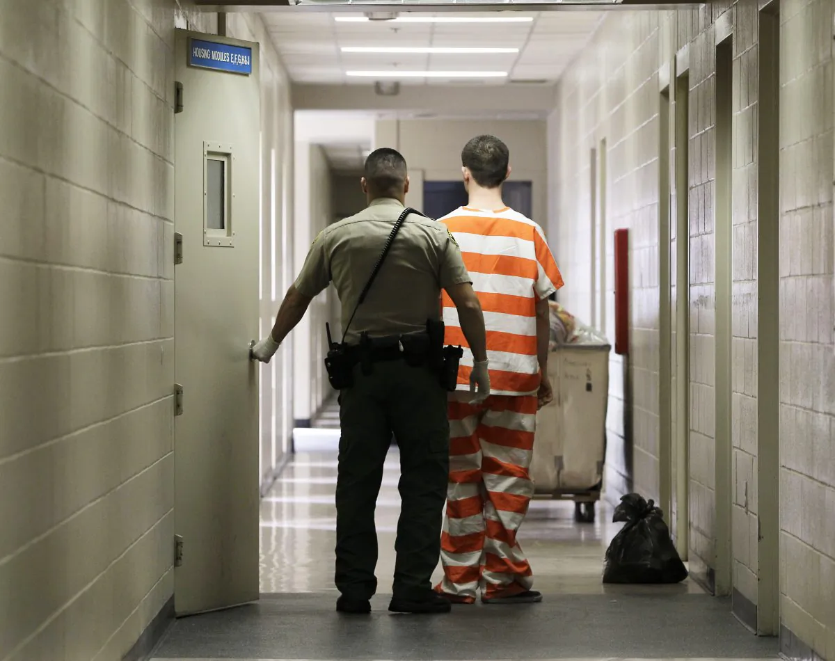 An inmate at the Madera County Jail is taken to an inmate housing unit in Madera, Calif., Feb. 21, 2013. (AP Photo/Rich Pedroncelli, file)