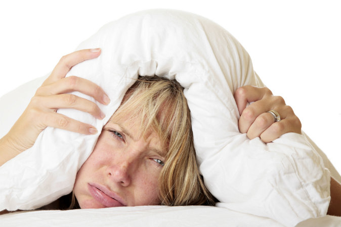 Woman trying to sleep (Shutterstock*)