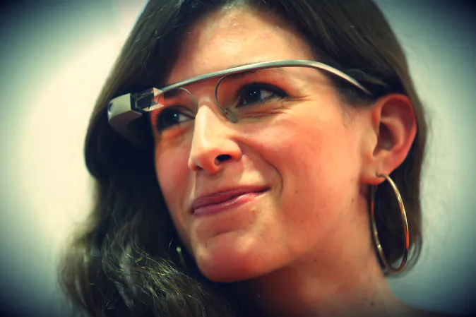 A young woman wears Google Glass at an unrelated book presentation and media event in Berlin, Germany on June 10, 2014. Google Glass, which films what the wearer sees and has a connection to the Internet, has caused controversy with privacy advocates. (Sean Gallup/Getty Images)