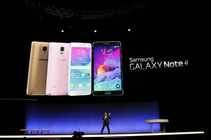 Executive Vice President of electronics giant Samsung D J Lee presents a new version of the company's giant-sized smartphone, the Galaxy Note 4, In Berlin, Germany on Sept. 3, 2014 in advance of the consumer electronics trade fair 'Internationale Funk Ausstellung '(IFA). IFA, one of Europe's biggest showcases of the latest electronic gadgets, is scheduled to open on September 5 and run until Sept. 10, 2014. (Odd Andersen/AFP/Getty Images)