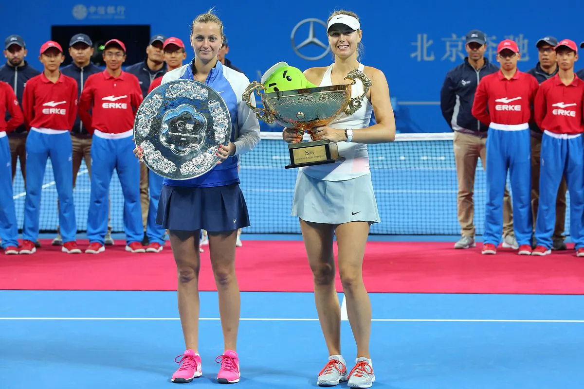 Maria Sharapova of Russia and Petra Kvitova of Czech Republic pose with their trophies during the medal ceremony after the Women’s Single Final on day nine of the China Open at the China National Tennis Center on October 5, 2014 in Beijing, China. (Chris Hyde/Getty Images)