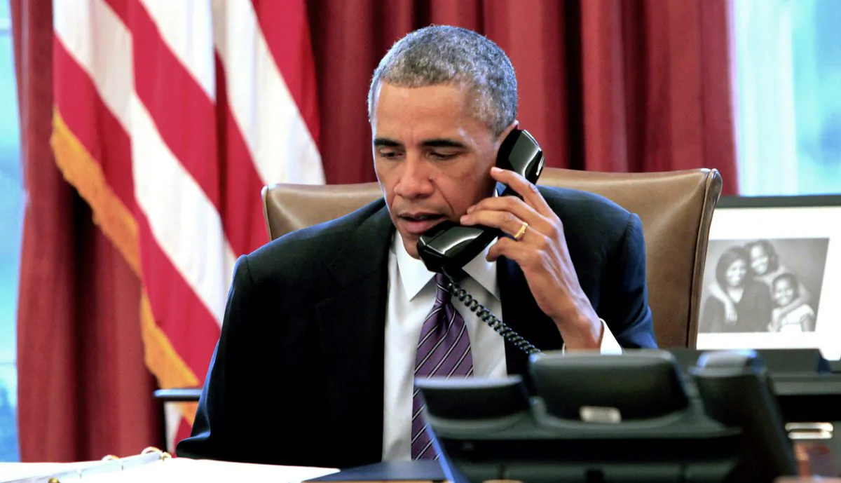 President Barack Obama participates in a conference call with state and local officials to discuss the Administration's domestic preparedness response to the Ebola epidemic in West Africa, on Oct. 6, 2014. (Dennis Brack/Getty Images)