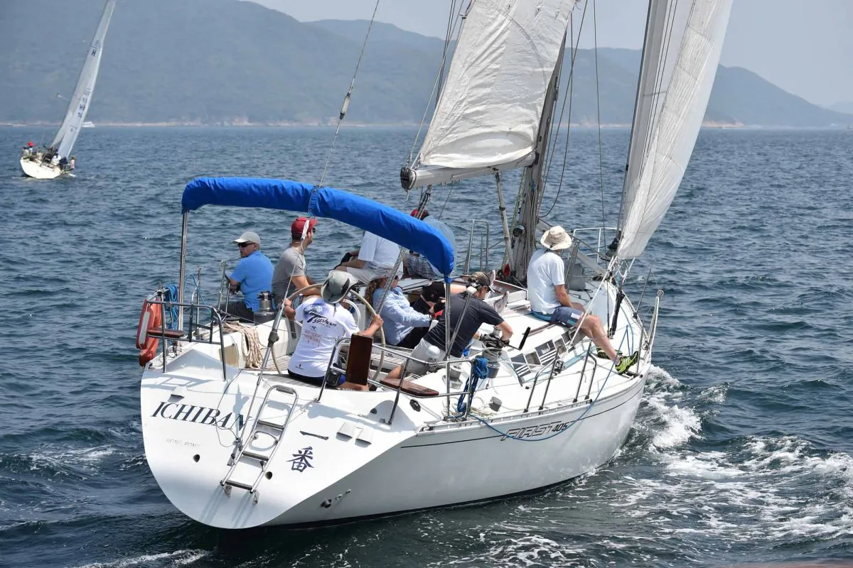 ‘Ichiban’ with Geoff Tayler at the Helm sailing upwind during Race-1 of the Helmsman races at Port Shelter on Sunday Oct 5, 2014. Ichiban finished 3rd in each of the two races to secure the overall 3rd place position. (Bill Cox/Epoch Times)