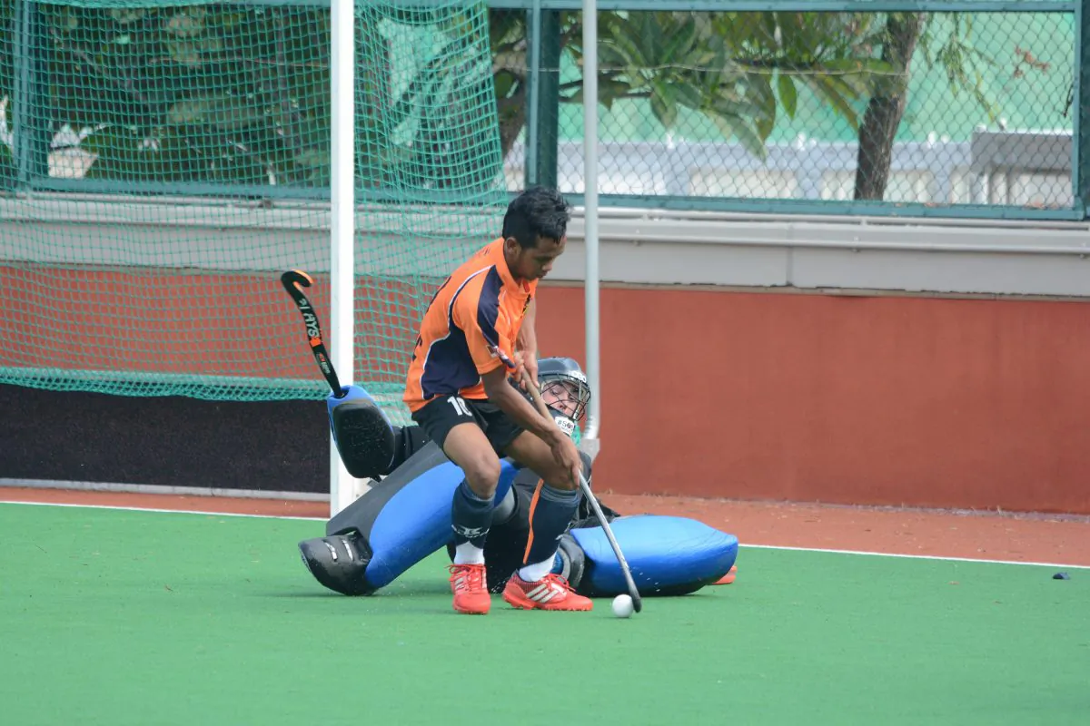 Former Malaysian International Faisal Saari, SSSC-A’s latest recruit, draws out HKFC-B keeper Rob Wilkinson in a goal attempt, but missed by mere inches, Sunday Oct 5, 2014. (Eddie So)
