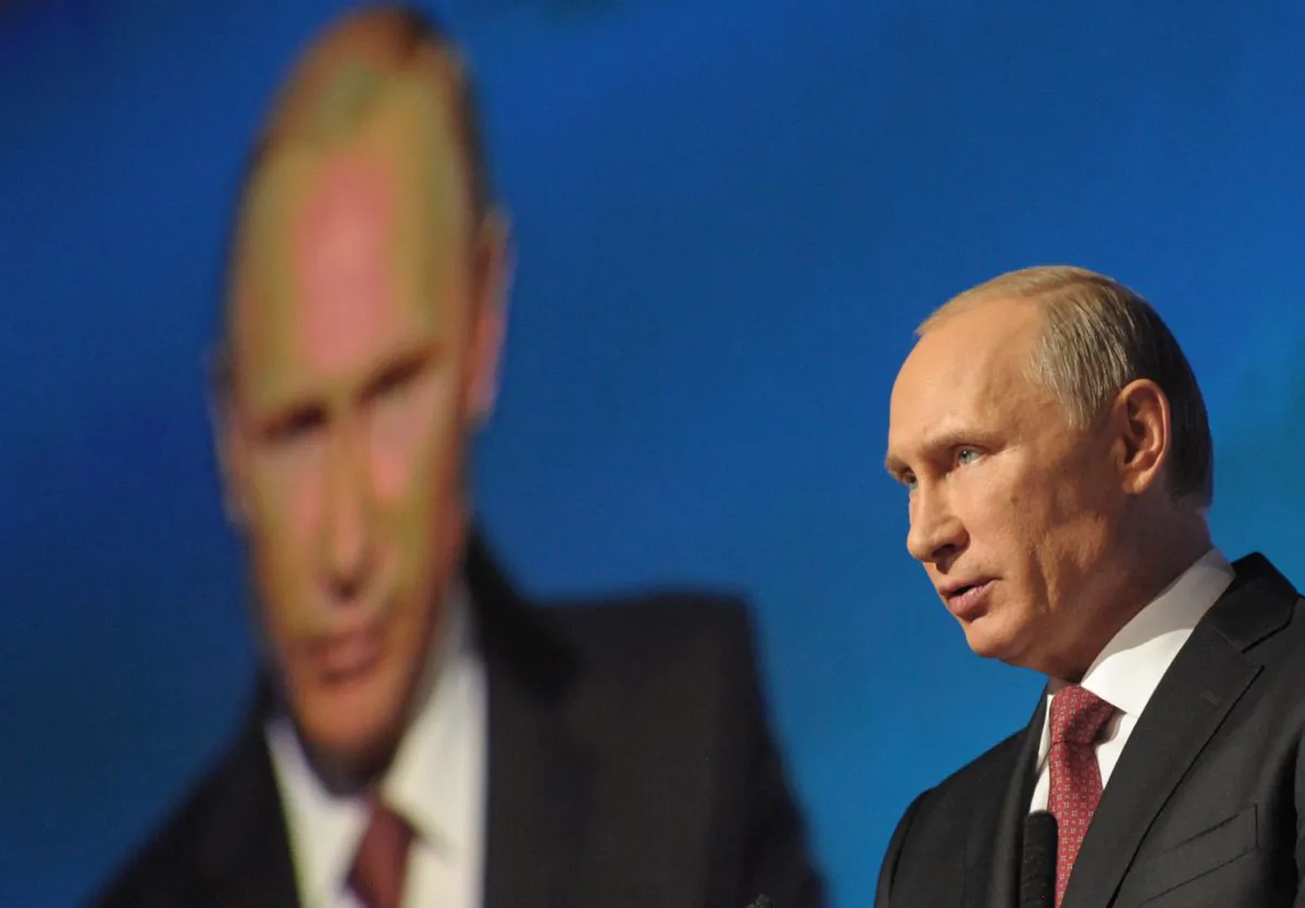 Russian President Vladimir Putin addresses an investment conference Russia Calling in Moscow, Russia, Thursday, Oct. 2, 2014. Russian President Vladimir Putin says the state will offer support to sectors of the economy that have been hit by international sanctions, but says the country in general is unconcerned about the sanctions' consequences. (AP Photo/RIA-Novosti, Alexei Druzhinin, Presidential Press Service)