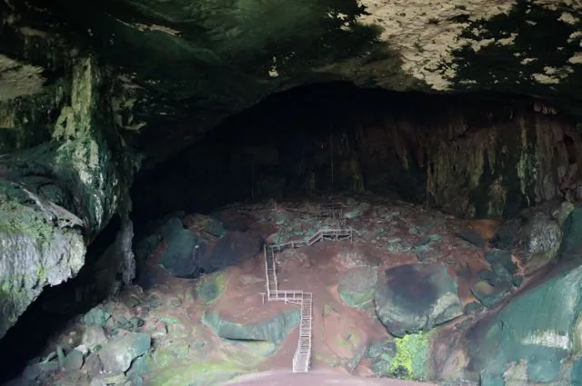 Stairs leading up into the darkness of Niahs Great Cave (Jonny Duncan, Backpacking Man)